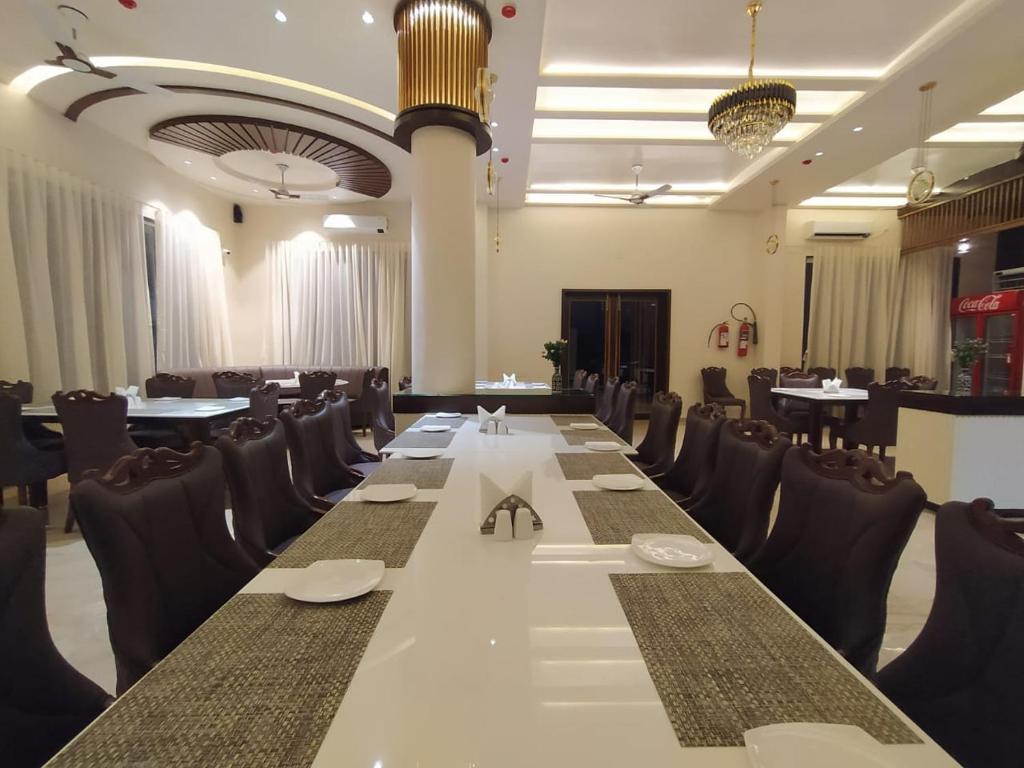 a conference room with a long table and chairs at Flamingo Club and Resort Una 3 Km Away from Diu Check Post in Diu