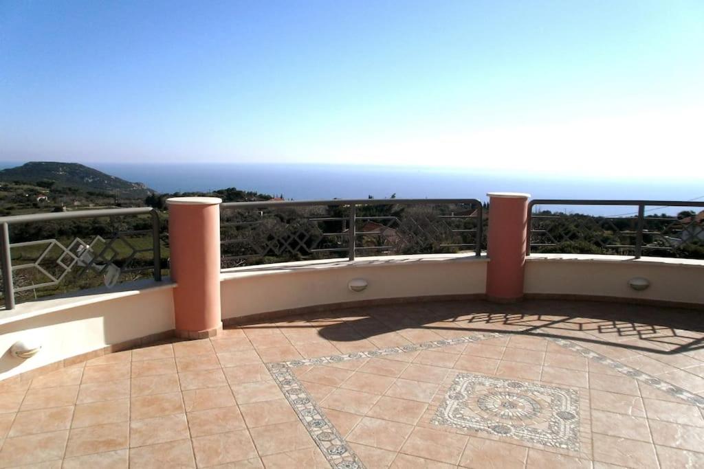 a balcony with a view of the ocean at Villa serenity in Kymi