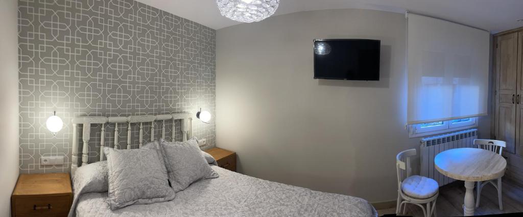 Postel nebo postele na pokoji v ubytování Apartamentos Casa Isabale