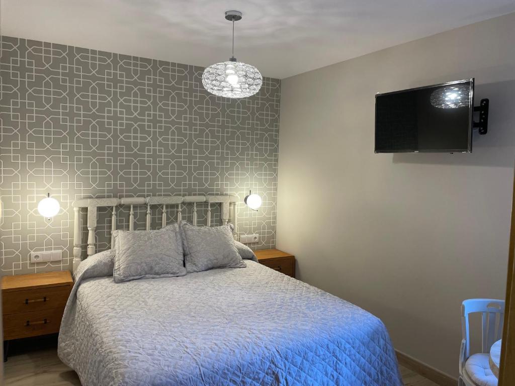 Postel nebo postele na pokoji v ubytování Apartamentos Casa Isabale