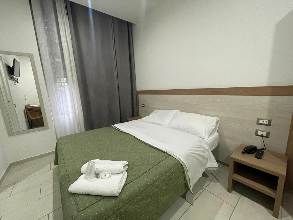 Postel nebo postele na pokoji v ubytování Hotel 26