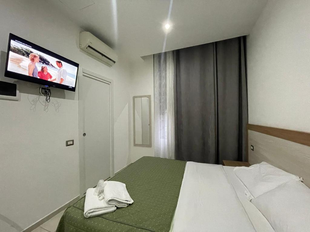 Postel nebo postele na pokoji v ubytování Hotel 26