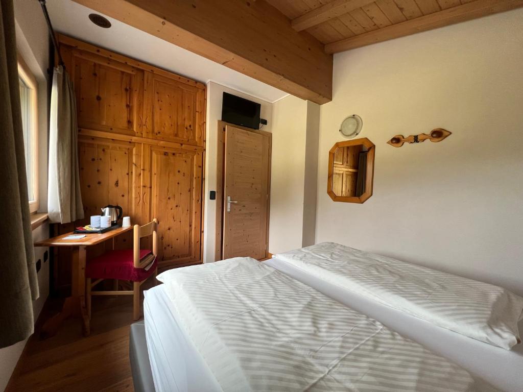 Postel nebo postele na pokoji v ubytování Hotel Le Alpi
