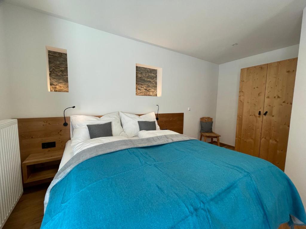 Postel nebo postele na pokoji v ubytování appartementsKOFLER