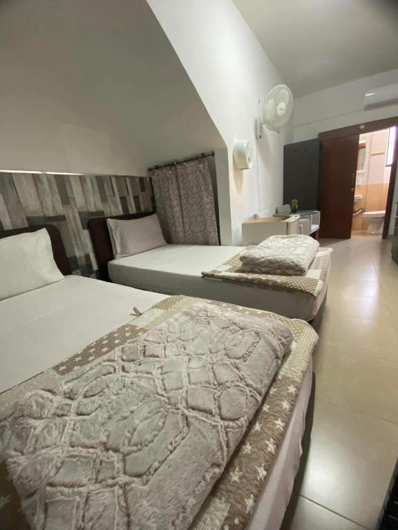 Кровать или кровати в номере Marina's Rooms