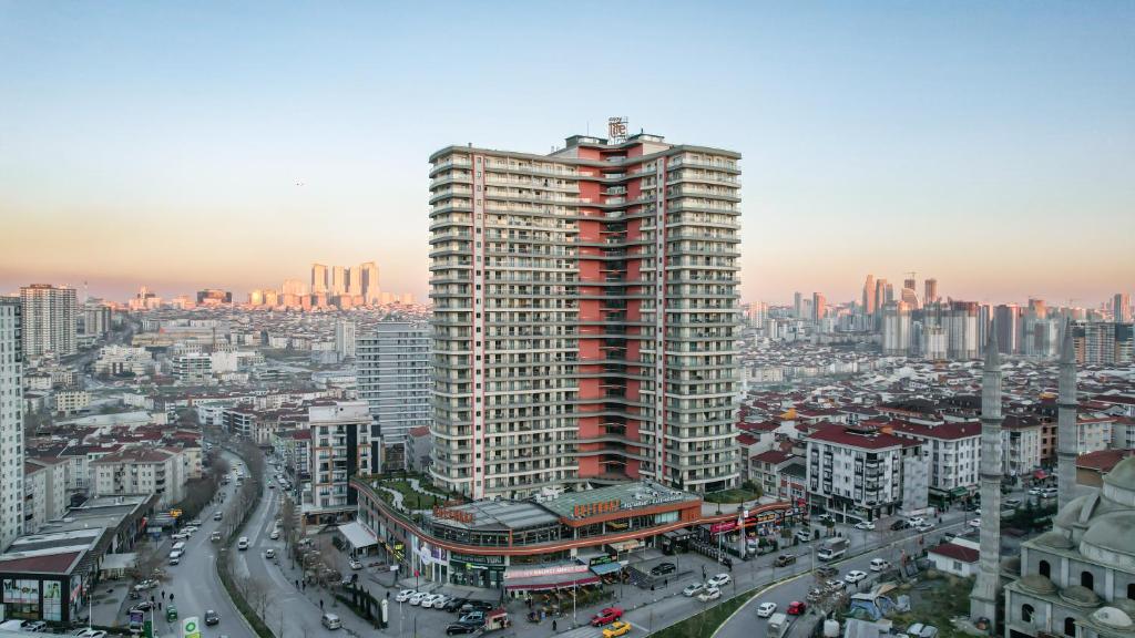 a view of a city with a tall building at 5 Star Hotel Concept Apartments with Spa and Sport Center in Esenyurt