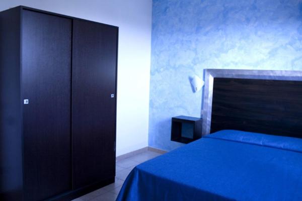 Postel nebo postele na pokoji v ubytování B&B Villa Francesco