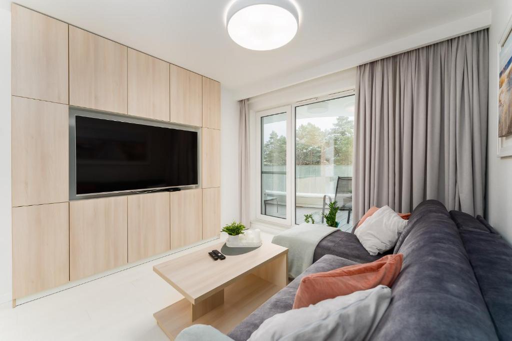 Telewizja i/lub zestaw kina domowego w obiekcie Sunrise Apartament