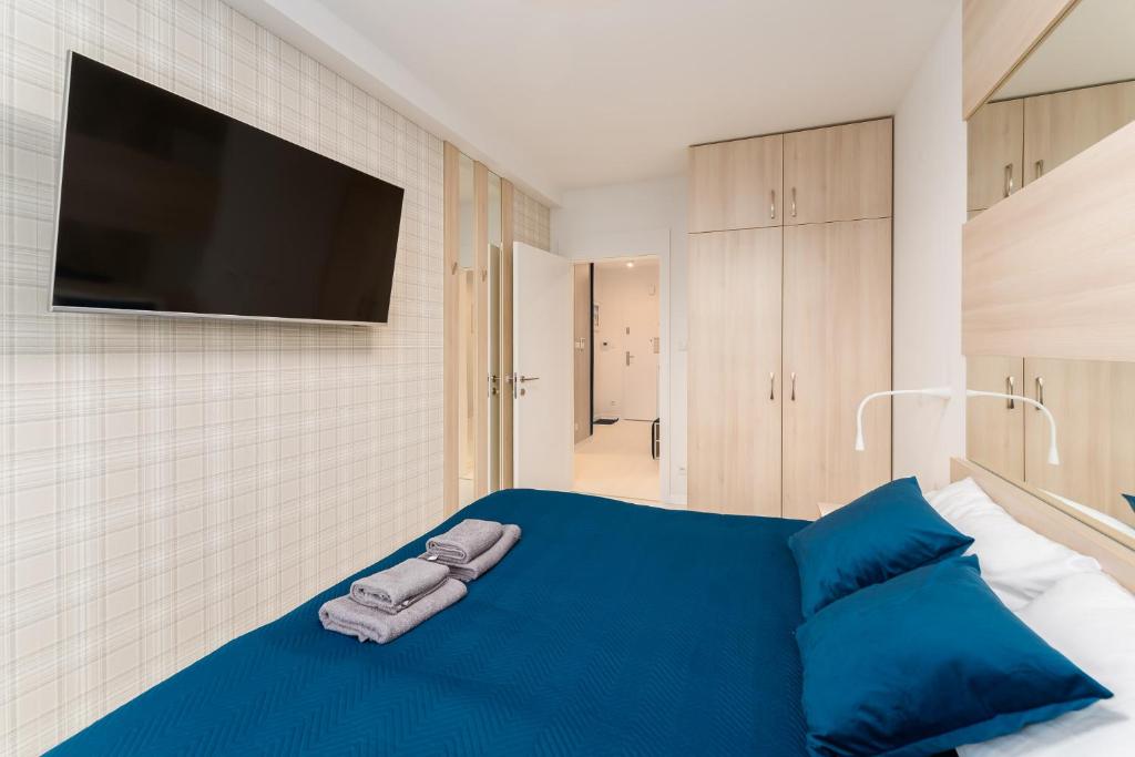 Łóżko lub łóżka w pokoju w obiekcie Sunrise Apartament