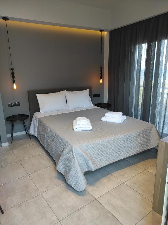 Ένα ή περισσότερα κρεβάτια σε δωμάτιο στο doloras_methana