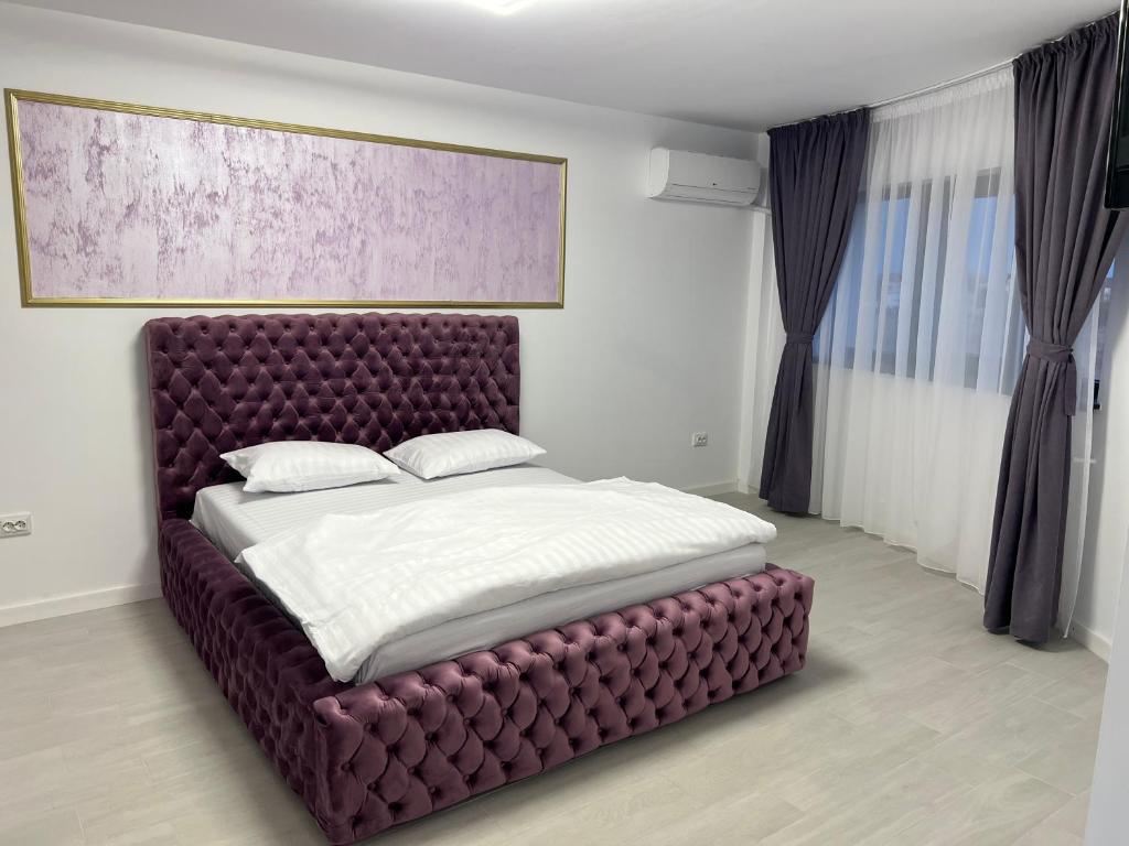 Tempat tidur dalam kamar di Vila 9