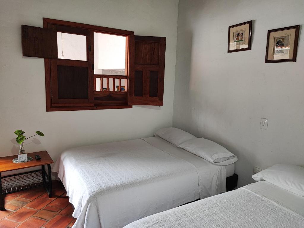 Postel nebo postele na pokoji v ubytování Casa Turistica Barichara