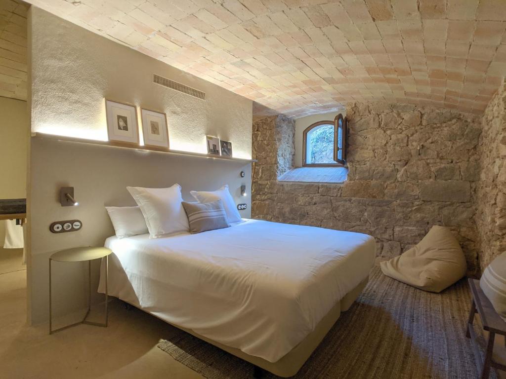 Postel nebo postele na pokoji v ubytování Torre de Can Puig
