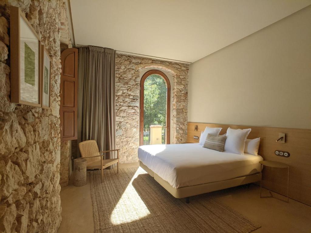 Postel nebo postele na pokoji v ubytování Torre de Can Puig