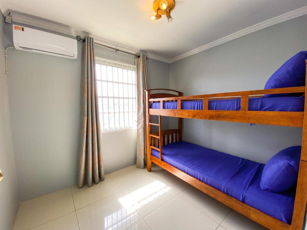 Postel nebo postele na pokoji v ubytování Benito Home