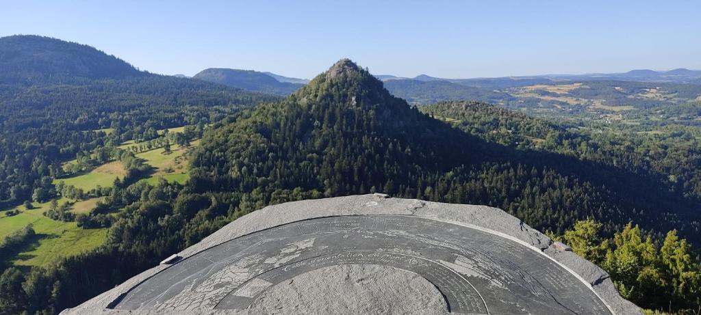 a view from the top of a mountain at Bulle de Bois, écolodge insolite avec spa privatif au milieu des volcans - Bulles d&#39;Herbe in Queyrières