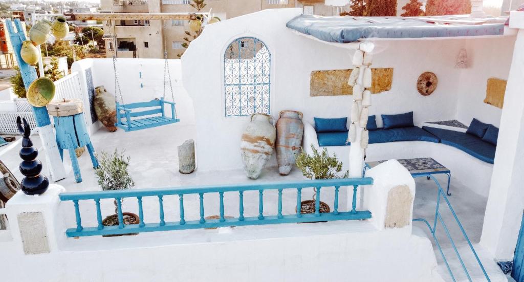 a model of a house with white and blue at El houch الحوش in Port El Kantaoui