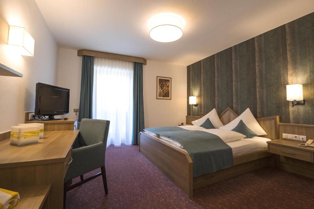 Postel nebo postele na pokoji v ubytování Hotel Maibad