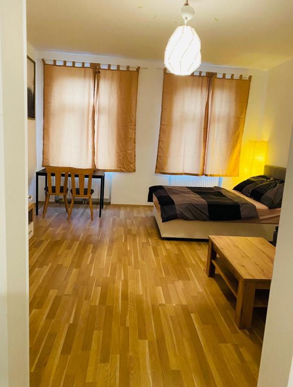 a bedroom with a bed and a table in it at Nice apartment Hollergasse 22 in Vienna