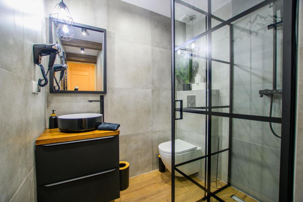 Kúpeľňa v ubytovaní Apartament Stryszek Alpinistyczny