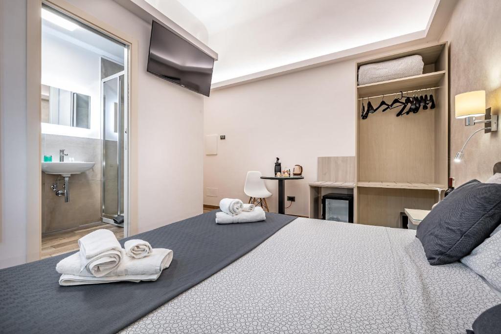 Postel nebo postele na pokoji v ubytování B&B Lorenzo de' Medici