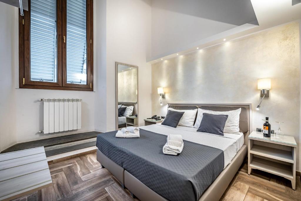 Postel nebo postele na pokoji v ubytování B&B Lorenzo de' Medici
