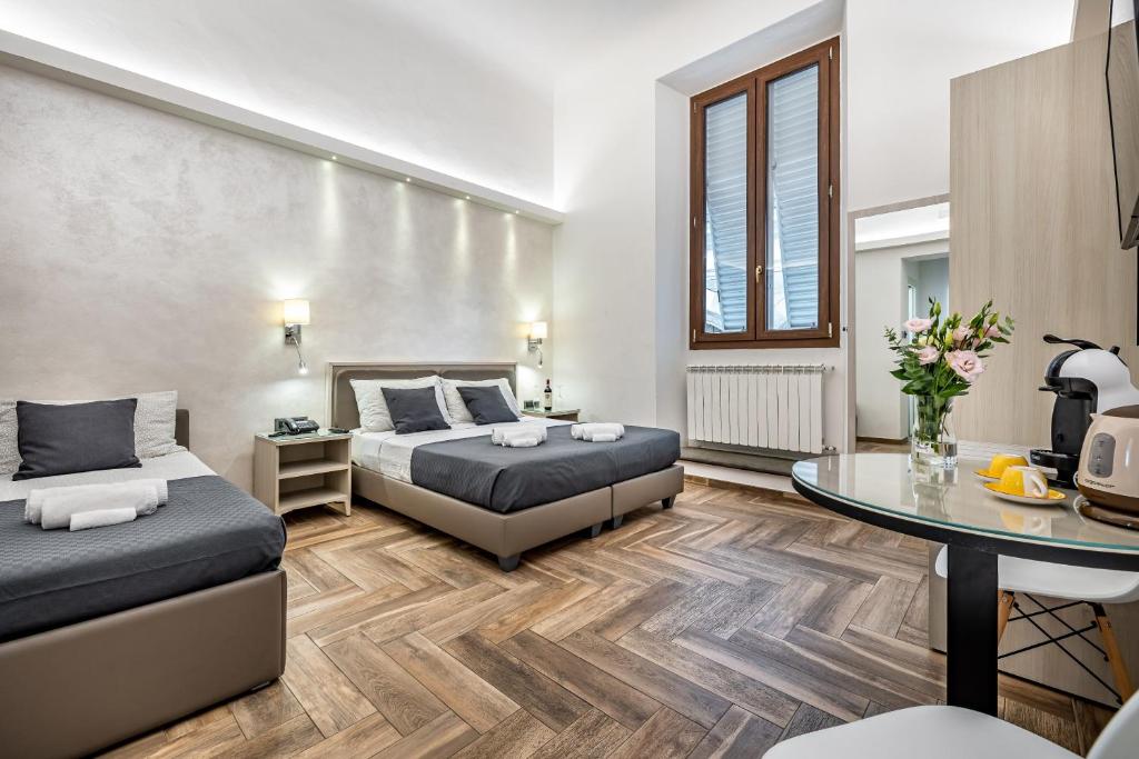 Postel nebo postele na pokoji v ubytování B&B Lorenzo de' Medici