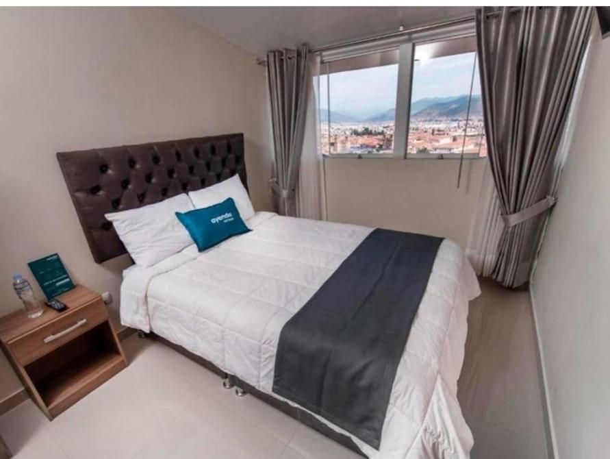 Postel nebo postele na pokoji v ubytování Hotel Luna de Oro Cusco