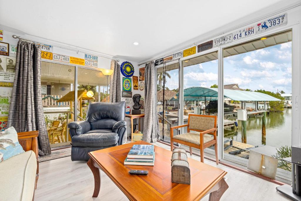 a living room with a view of a marina at Sunset Escape in Marco Island