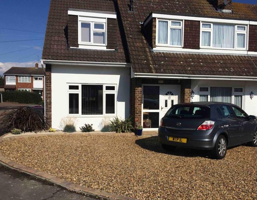 a car parked in front of a house at 1 bedroom apartment with parking. in Great Wakering