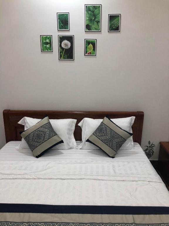 Postel nebo postele na pokoji v ubytování Coffee Pacific Grand World Phú Quốc