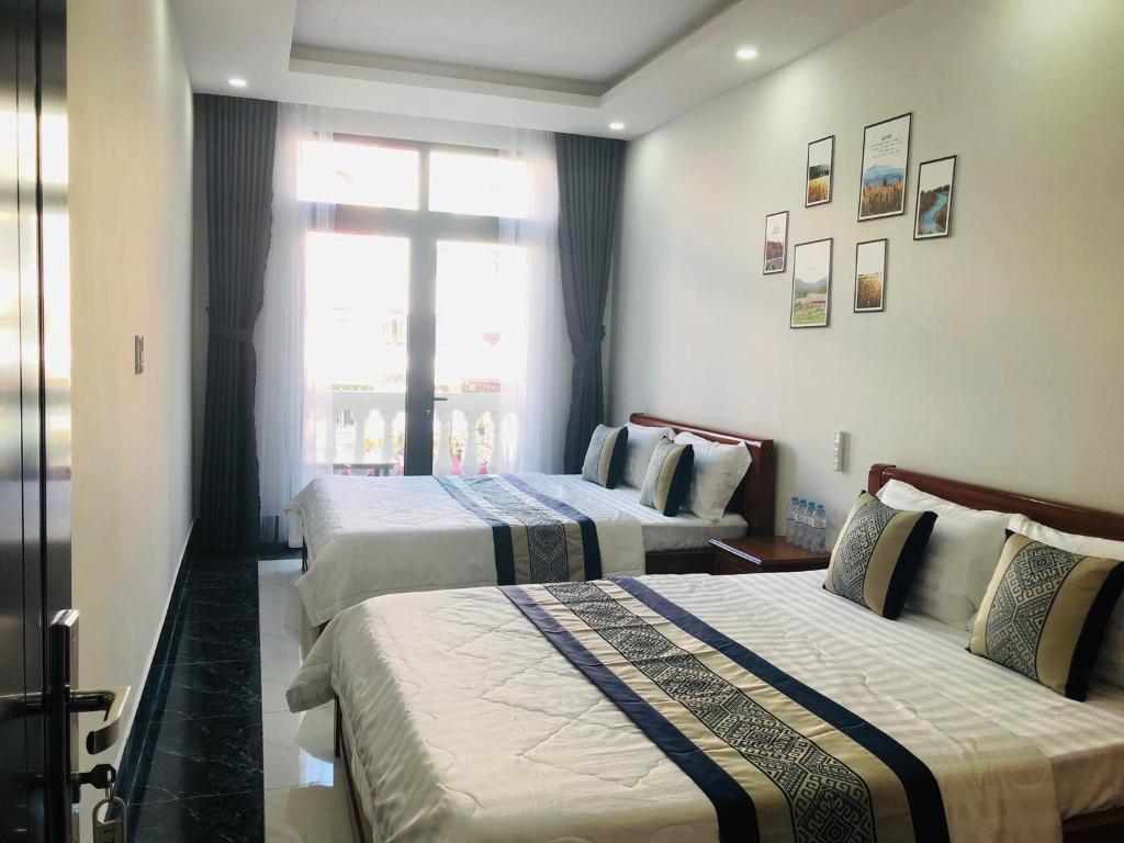 Postel nebo postele na pokoji v ubytování Coffee Pacific Grand World Phú Quốc