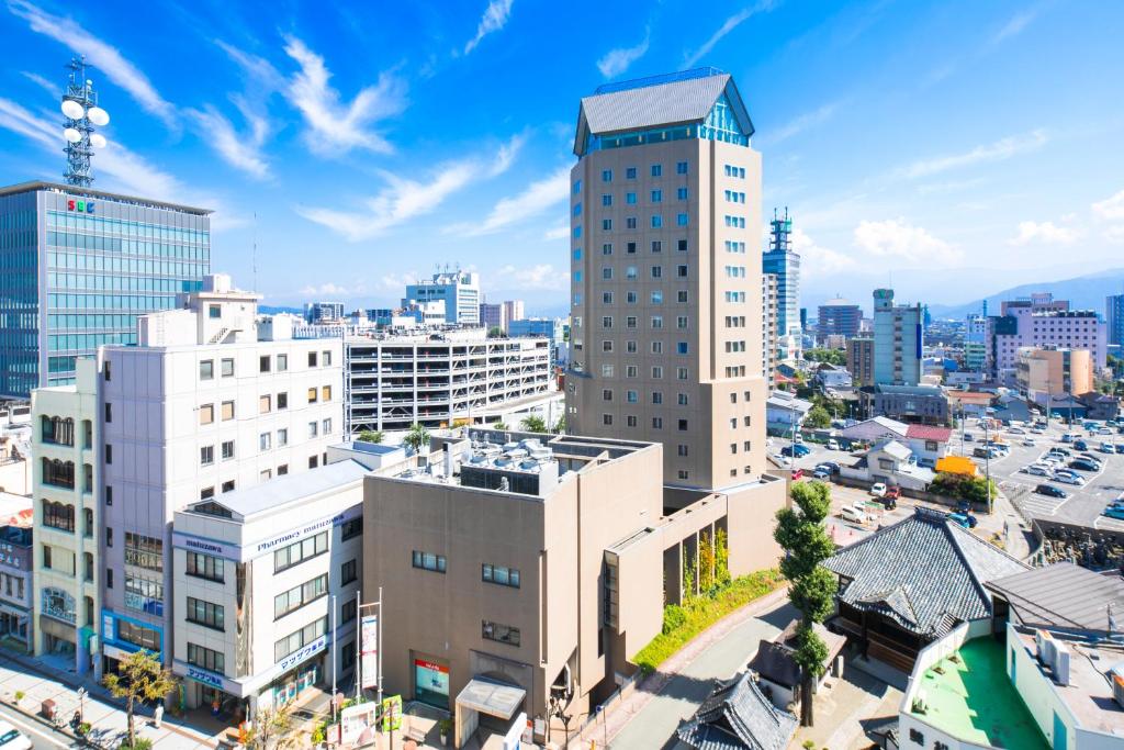 an aerial view of a city with tall buildings at Hotel JAL City Nagano in Nagano