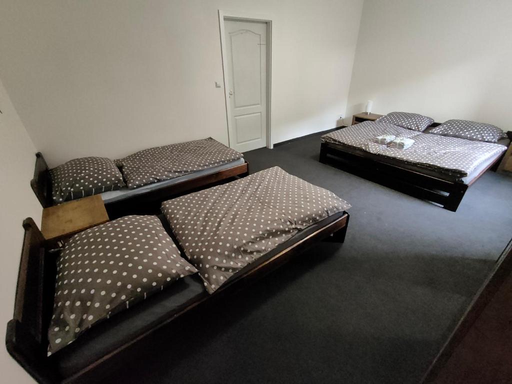 Postel nebo postele na pokoji v ubytování Apartmány Na Cestě