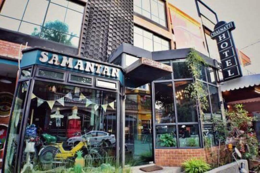 a santander store in front of a building at Samantan Hotel at Nimman in Chiang Mai