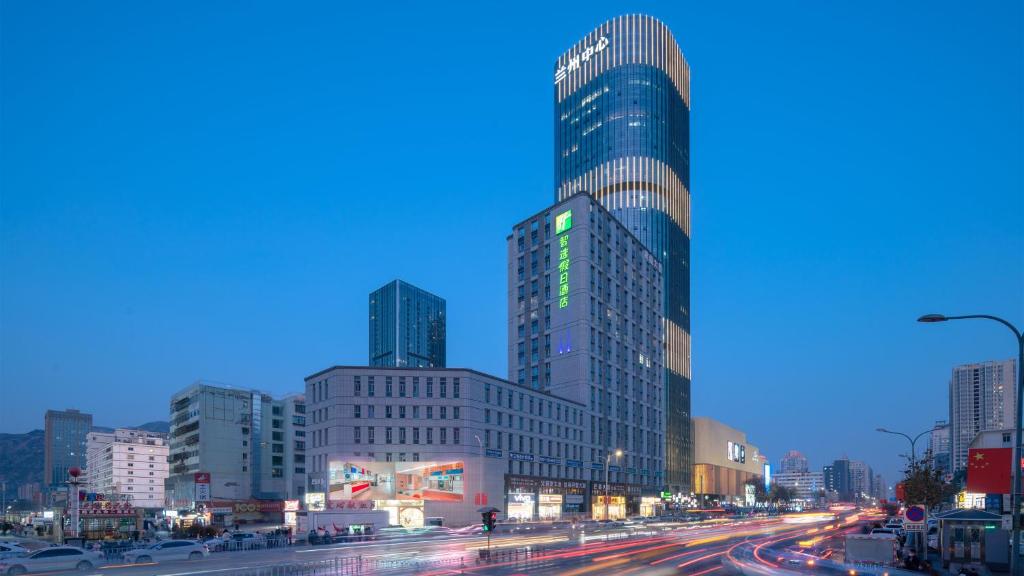 a city with tall buildings and a street with cars at Holiday Inn Express Lanzhou Jianlan, an IHG Hotel in Lanzhou