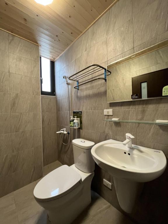 Koupelna v ubytování 威世紀行旅
