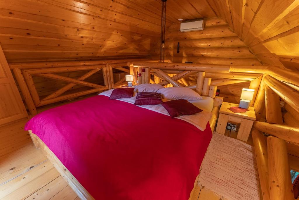 an overhead view of a bedroom in a log cabin at Korošec Apartments and Wellness Centre in Mozirje