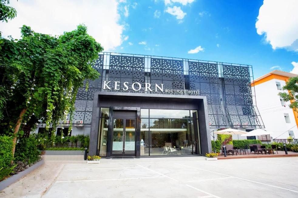a building with a sign on the front of it at Kesorn Boutique Hotel in Buriram