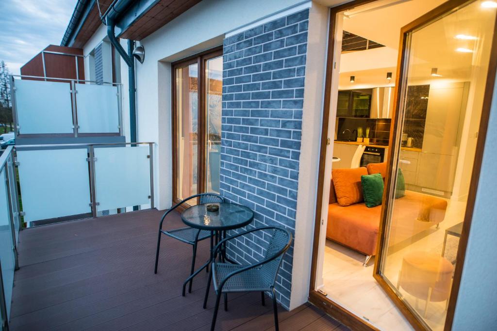 Posezení v ubytování Nowoczesny apartament na Warmii i Mazurach z garażem