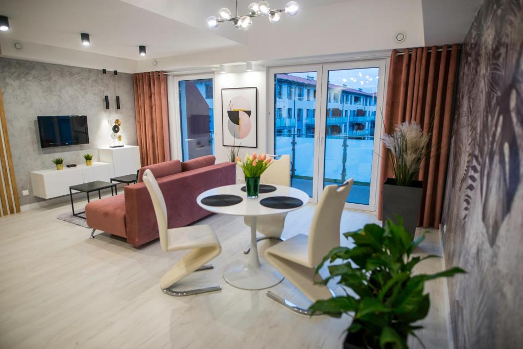 Posezení v ubytování Nowoczesny apartament na Warmii i Mazurach z garażem