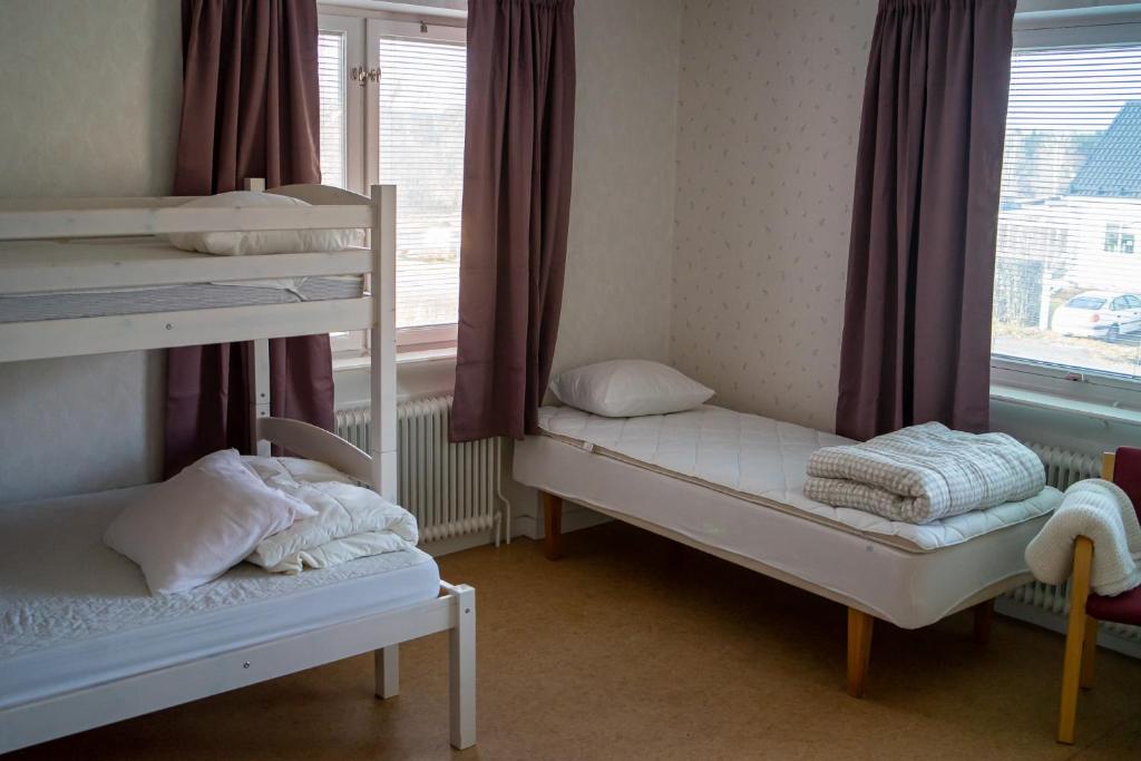 Postel nebo postele na pokoji v ubytování Semesterboende med Gym & Vackra vyer