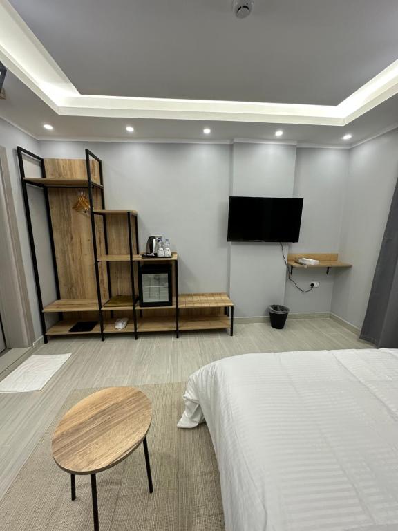 TV a/nebo společenská místnost v ubytování Blue Rose Hotel