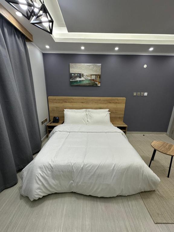 Postel nebo postele na pokoji v ubytování Blue Rose Hotel