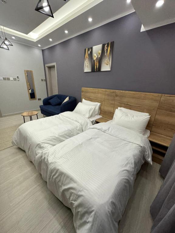 Postel nebo postele na pokoji v ubytování Blue Rose Hotel