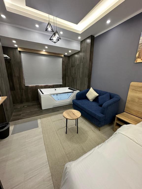 Postel nebo postele na pokoji v ubytování Blue Rose Hotel