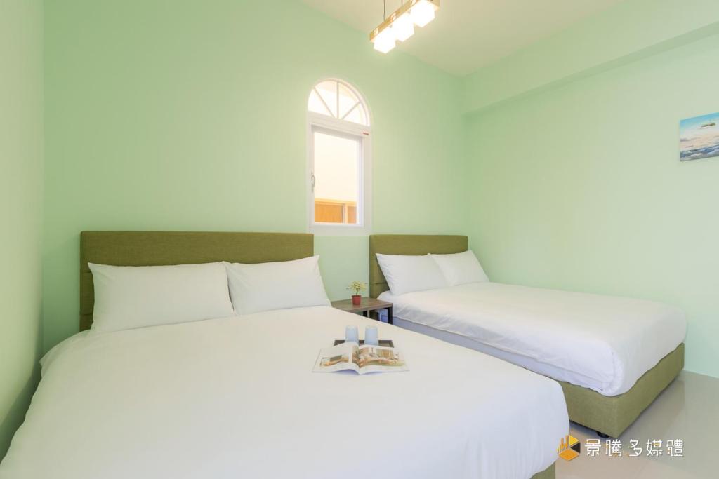Postel nebo postele na pokoji v ubytování Tie Zhi Road B&B