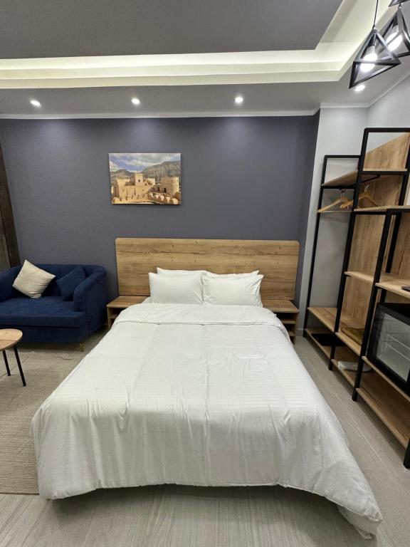 Postel nebo postele na pokoji v ubytování Blue Rose Hotel