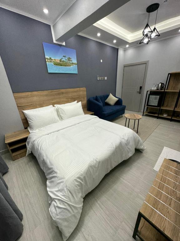 Postel nebo postele na pokoji v ubytování Blue Rose Hotel