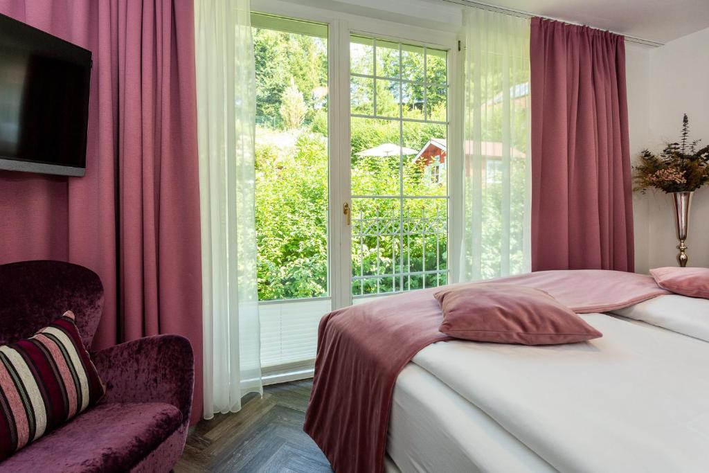 Postel nebo postele na pokoji v ubytování Boutiquehotel Bergvilla